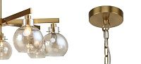 Люстра с плафонами коньячного цвета Carmella Globe Brass Loft-Concept 40.6201-3